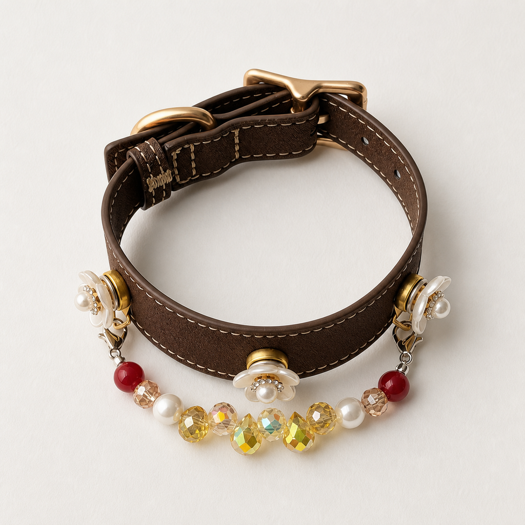 Brown floral charm dog collar assembled with gold-tone hardware on a white background