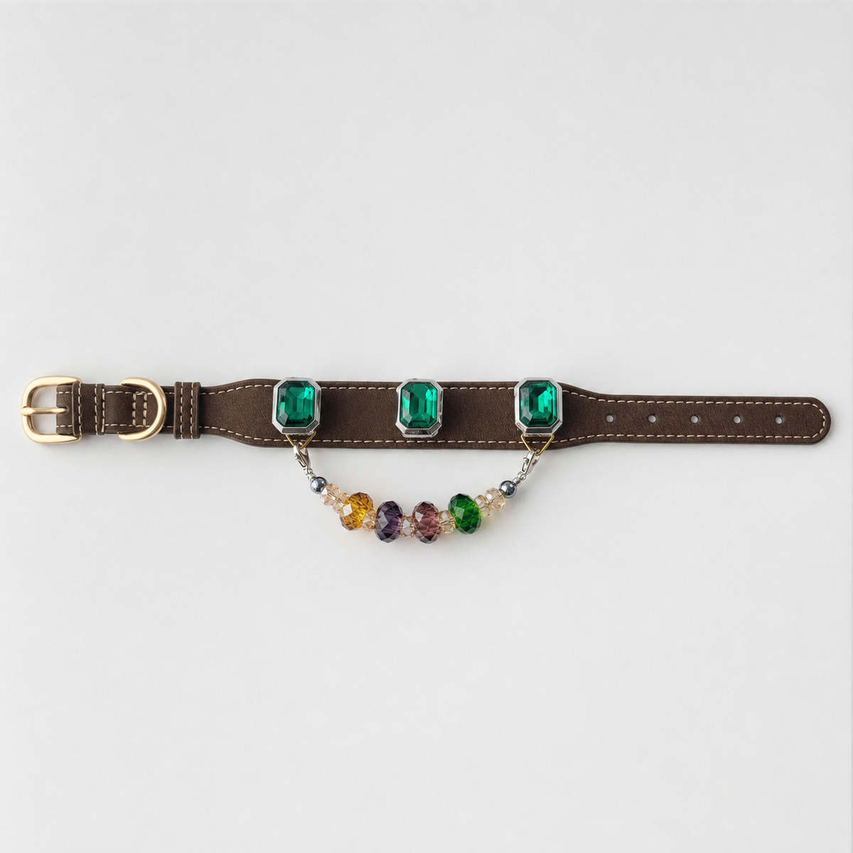 Full-length brown dog collar with three green charms and multicolor bead strand laid flat
