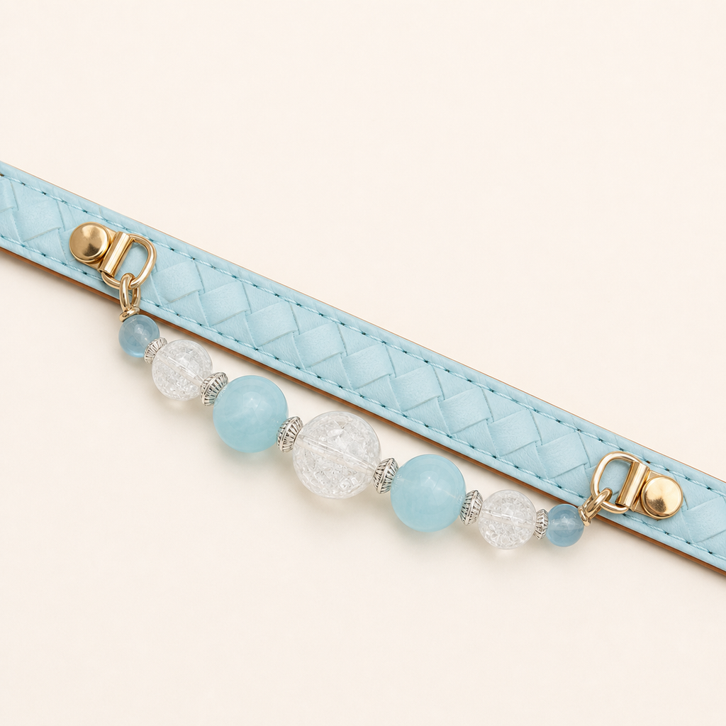 Aqua basketweave dog collar laid flat with fixed blue and clear bead strand