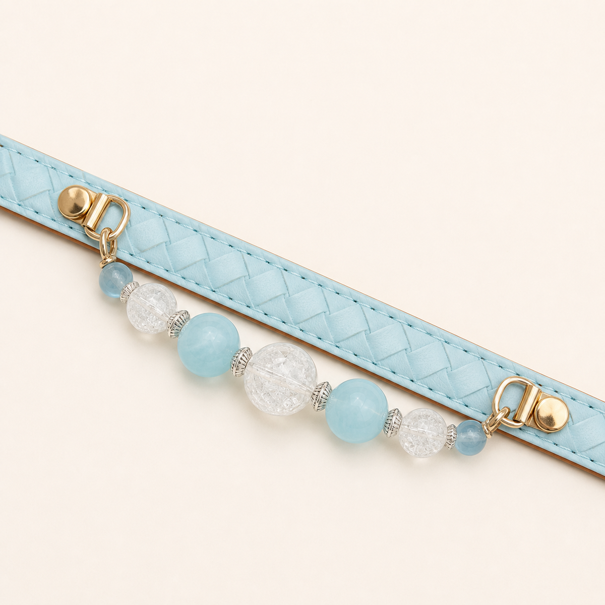 Aqua basketweave dog collar laid flat with fixed blue and clear bead strand